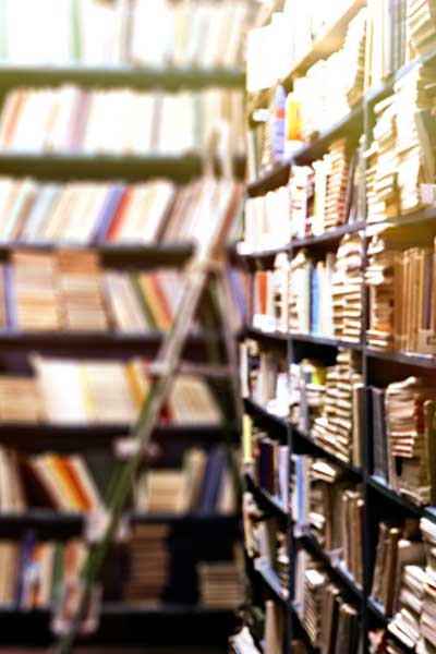 shelves full of books in a library