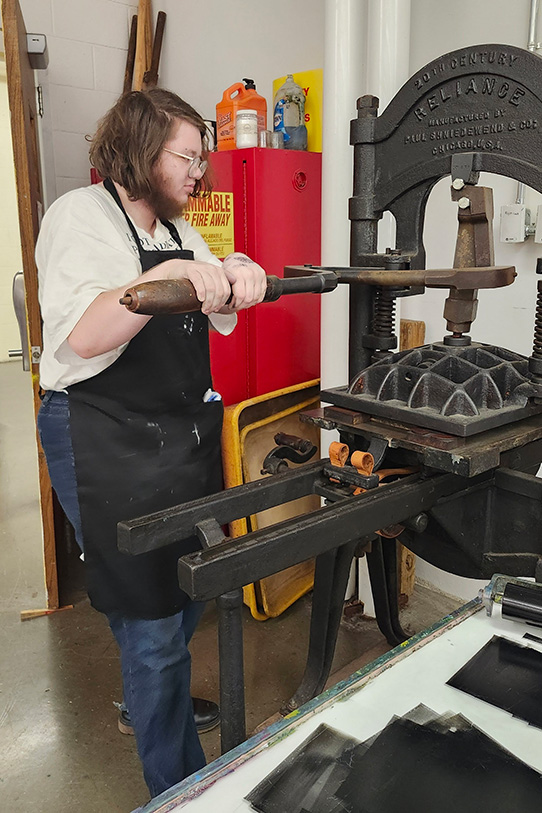 Cael Sinclair operates historical machinery